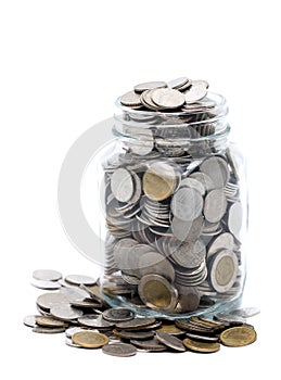 Thai coins in a glass jar