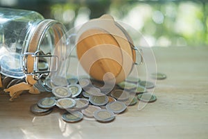 Thai coins in and outside the glass jar, Thai Baht currency