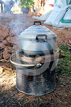 Thai cooking style, steam pot on vintage local fire-stove