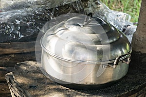 Thai cooking style, steam pot on vintage local fire-stove in kitchen of old wooden house