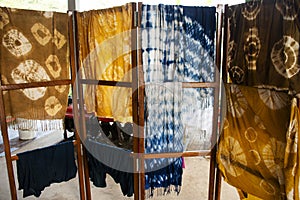 Thai craftsmanship artist working batik ikat tie dye cotton and silk fabric with natural color in handmade handicrafts local