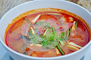 Thai cuisine name Tom yum goong is prawn and lemon grass soup with mushrooms