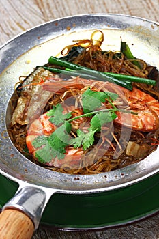 Thai cuisine, steamed prawns with vermicelli in metal casserole pot
