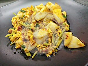 Thai cuisine stir squid in salted egg yolk sauce