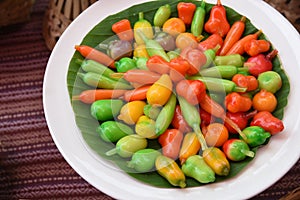 Thai dessert  deletable imitation fruits - kanom look choup made from stirred bean mixed with sugar and coconut covered with glass