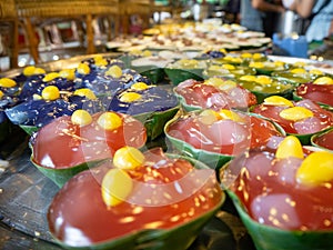 Thai Dessert name Tako colorful,Sweet taste made from materials coconut milk and sugar on banana leaf,At market Bangkachao Bangkok