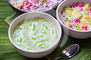 Thai dessert - Thai rice flour pandan leaf with coconut milk and syrup sweets dessert on white bowl, Asian food