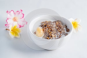 Thai desserts, sago desserts with longan topped with coconut milk
