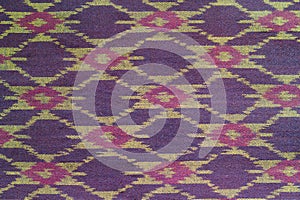 Thai fabric pattern as background.