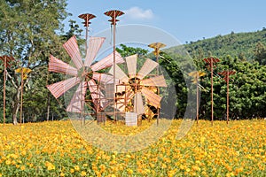 Thai fabric windmill and kite on yellow Kibana Cosmos garden