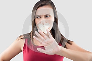 Thai female in with adhesive tape over his mouth.