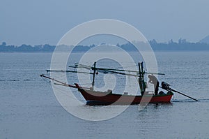 Thai fisherman in a sea