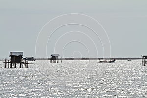 Thai fishermen is waiting on the boat, for fish , life