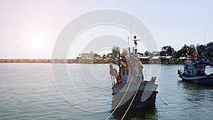 Thai fishing boat at pier habor in the morning