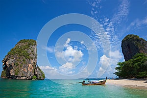 Thai fishing boats on the azure sea on the bounty beach in thailand