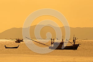 Thai fishing boats at sunset