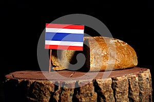 Thai flag on a stump with bread