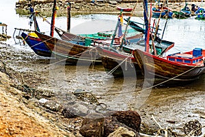 A Thai-flagged fishing boat is stranded on the pier. photo