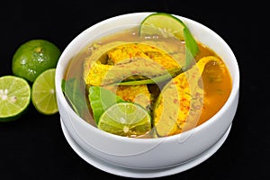 Thai Food Fish Curry with Lemon slice On Black.
