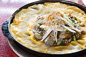 Thai food, fried mussel pancake in hot pan