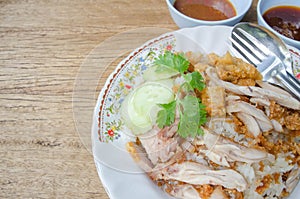 thai food gourmet fried chicken with rice, khao man kai tod crispy pork in wood background.