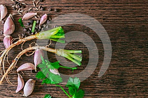 Thai food herb garlic and coriander ingredient on wood