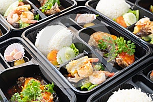 Thai food lunch boxes in plastic packages