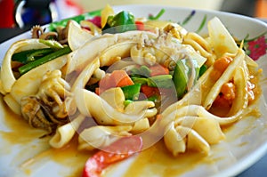 Thai food name Stir Fried Squid with Curry and Salted Eggs photo