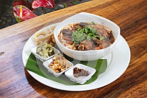 Thai Food, Rice vermicelli in northern thai red curry sauce with pork ribs and pork blood curd