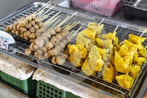 Thai food skewers of sausage chicken meatballs fishballs grilled Thailand