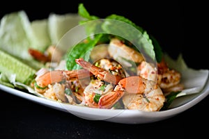 Thai food - spicy Shrimp salad with garlic and basil