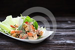 Thai food - spicy Shrimp salad with garlic and basil