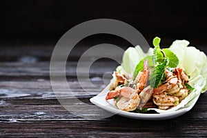 Thai food - spicy Shrimp salad with garlic and basil