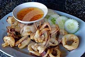 Thai food, Squid with garlic pepper Pla Muek Tod Kra Thiam Phrik Thai with sweet dipping