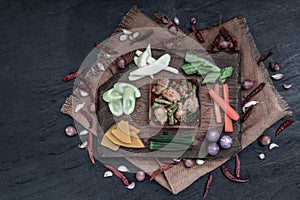 Thai food, Stir Fried fish ball with Red Curry Paste and long bean with the ingredient and fresh vegetables on wood background