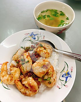 Thai food - Stir-fried prawns with spring onions on rice and soup