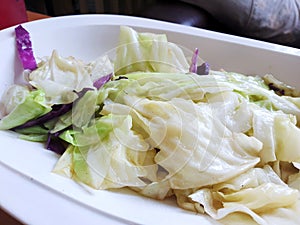Thai food style, Selective focus of stir fried cabbage with fish sauce in white plate