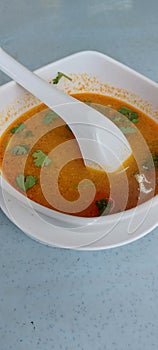 Thai food - Tom Yum Kung or tomyam in white bowl