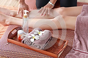 Thai foot massage alternative medicine therapy with Thai herb aroma oil , background for spa and alternative medical therapy