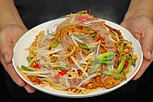 Thai fried local Korat noodle with cube tofu and minced pork, c