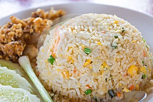 Thai fried rice with vegetables, chicken and fried eggs