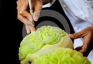 Thai fruit carving with hand, Vegetable and Fruit Carving photo