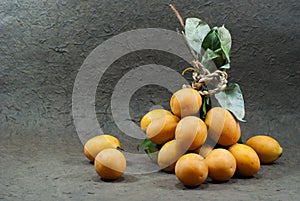 Thai Fruit , Maprang Fruit on the gray background.