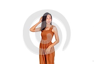 Thai girl long hair in brown tank top dress scratch her hair