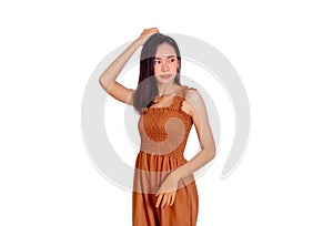 Thai girl long hair in brown tank top dress touch her hair