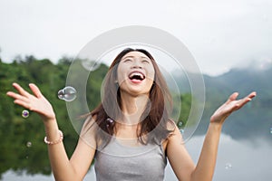 Thai girl smile and happy with air bubbles