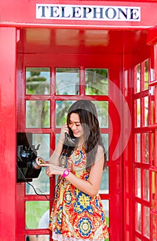 Thai girl is talking with an old-fashion phone