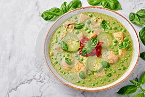 Thai Green Curry with Chicken or Gaeng Kaew Wan Gai on white marble background. Thai Food