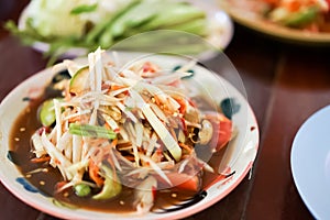 Thai green papaya salad, which is also known as Som Tam is one of the most commonly available and most popularly consumed dishes