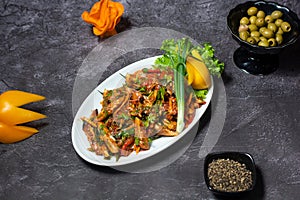 Thai Grilled Chicken Salad with olive and black pepper served in dish isolated on grey background top view of indian and